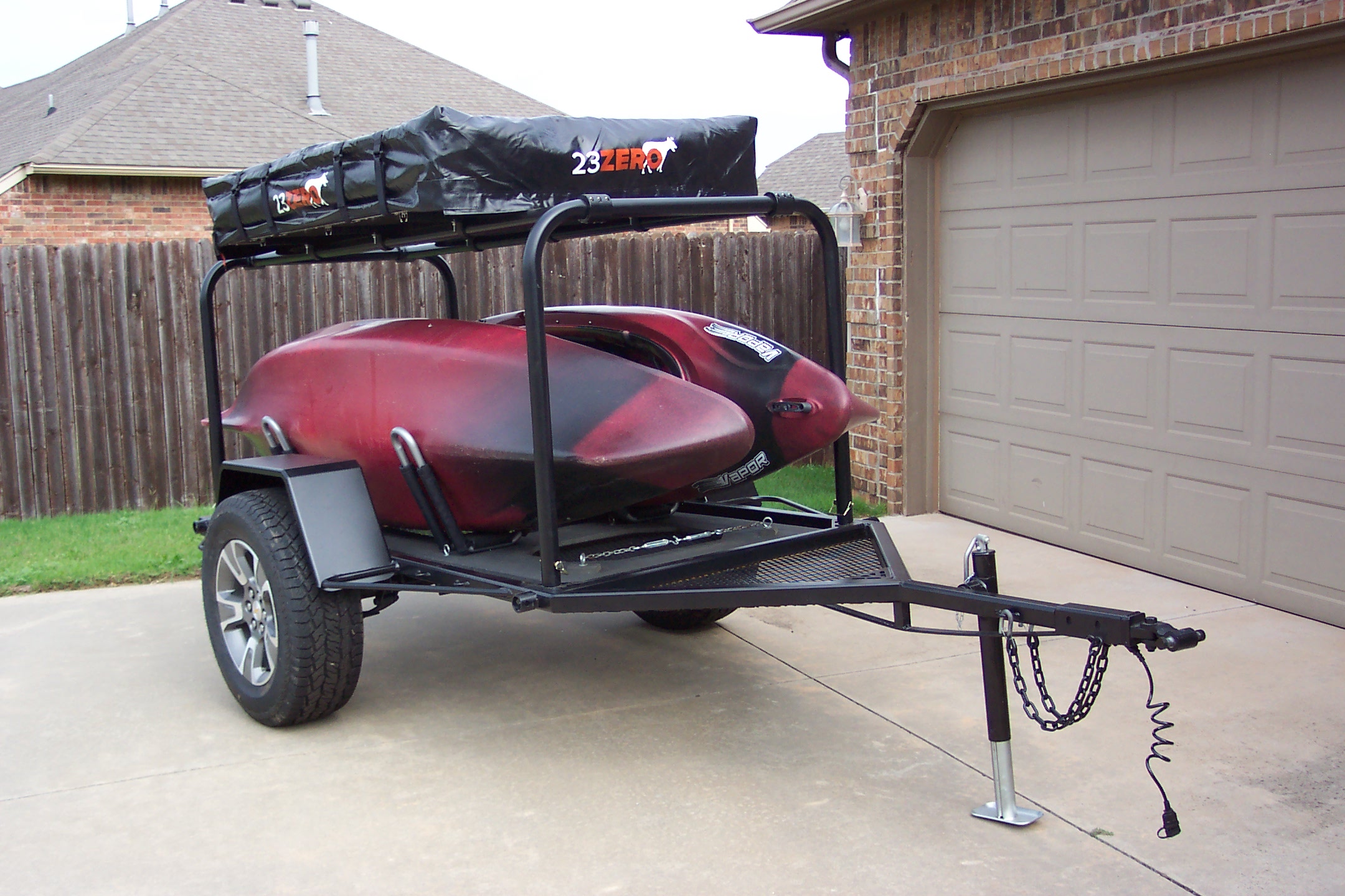Twain Trailers Mark I with two 10-foot kayaks and 23Zero rooftop tent